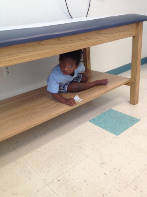 Hiding before the doctor comes in the room.  